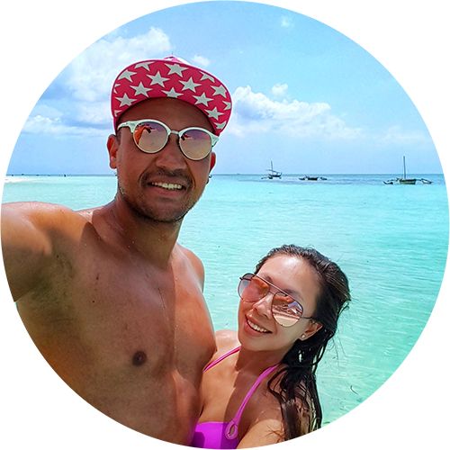 Chloe and Michael from Nomad And In Love taking a selfie on a beach in Zanzibar